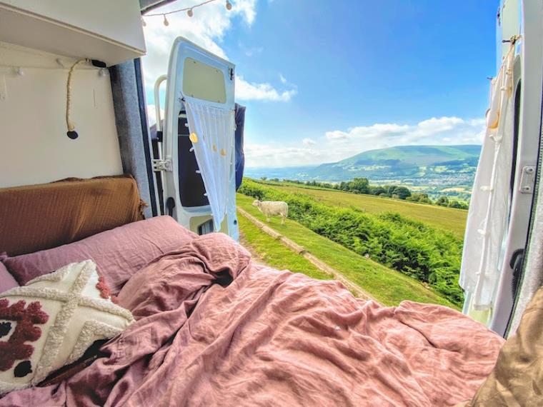 View from campervan over green hills