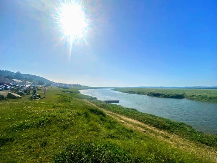 View of estuary under the sun